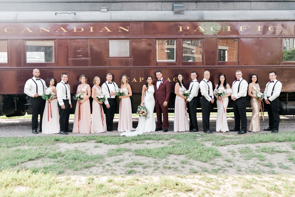 bridal party in front of train