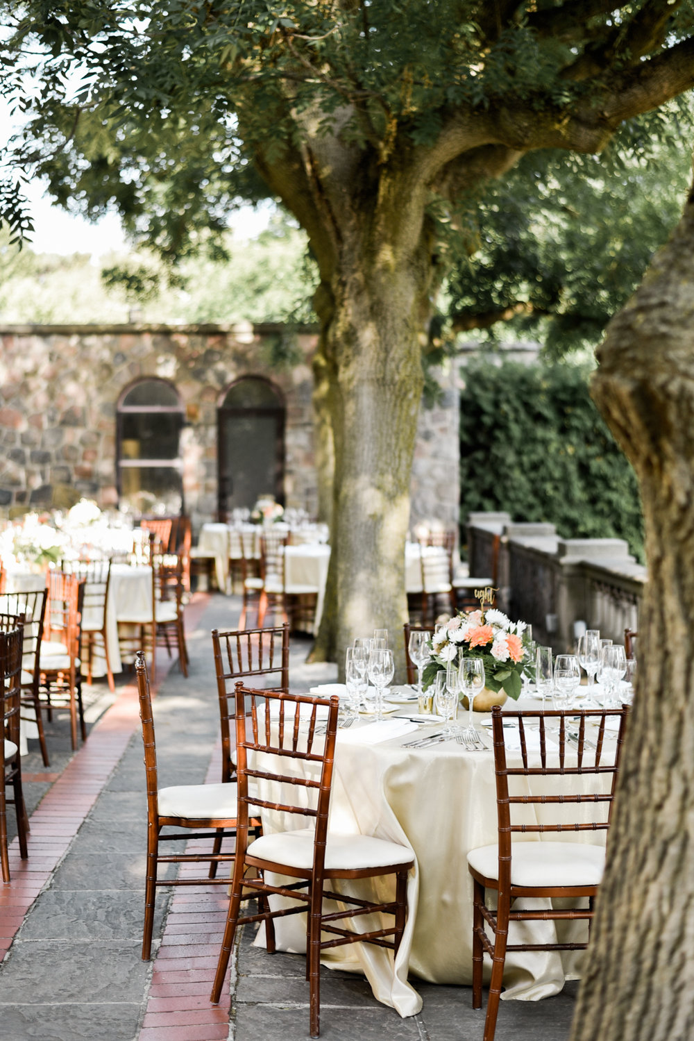The most gorgeous outdoor tablescape at graydon hall wedding in between the trees