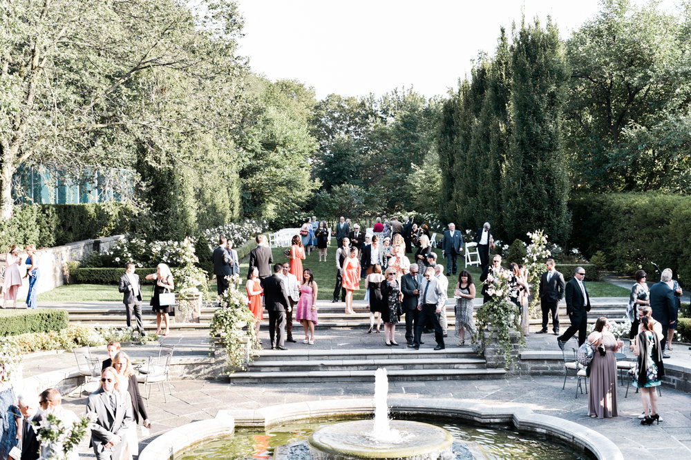guests at graydon hall summer wedding on the lawn