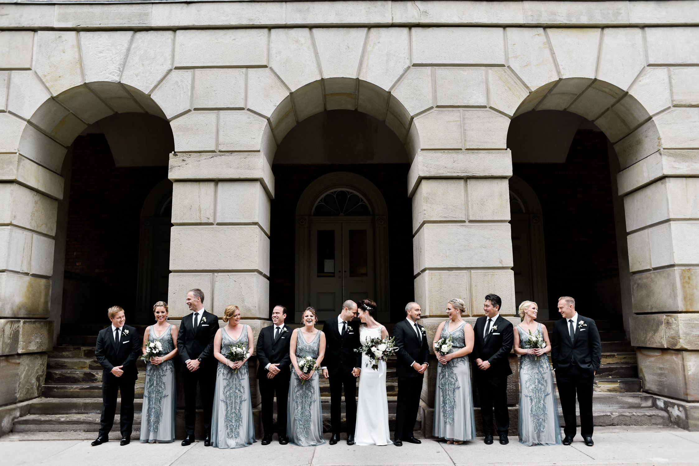 wedding party photo with architecture