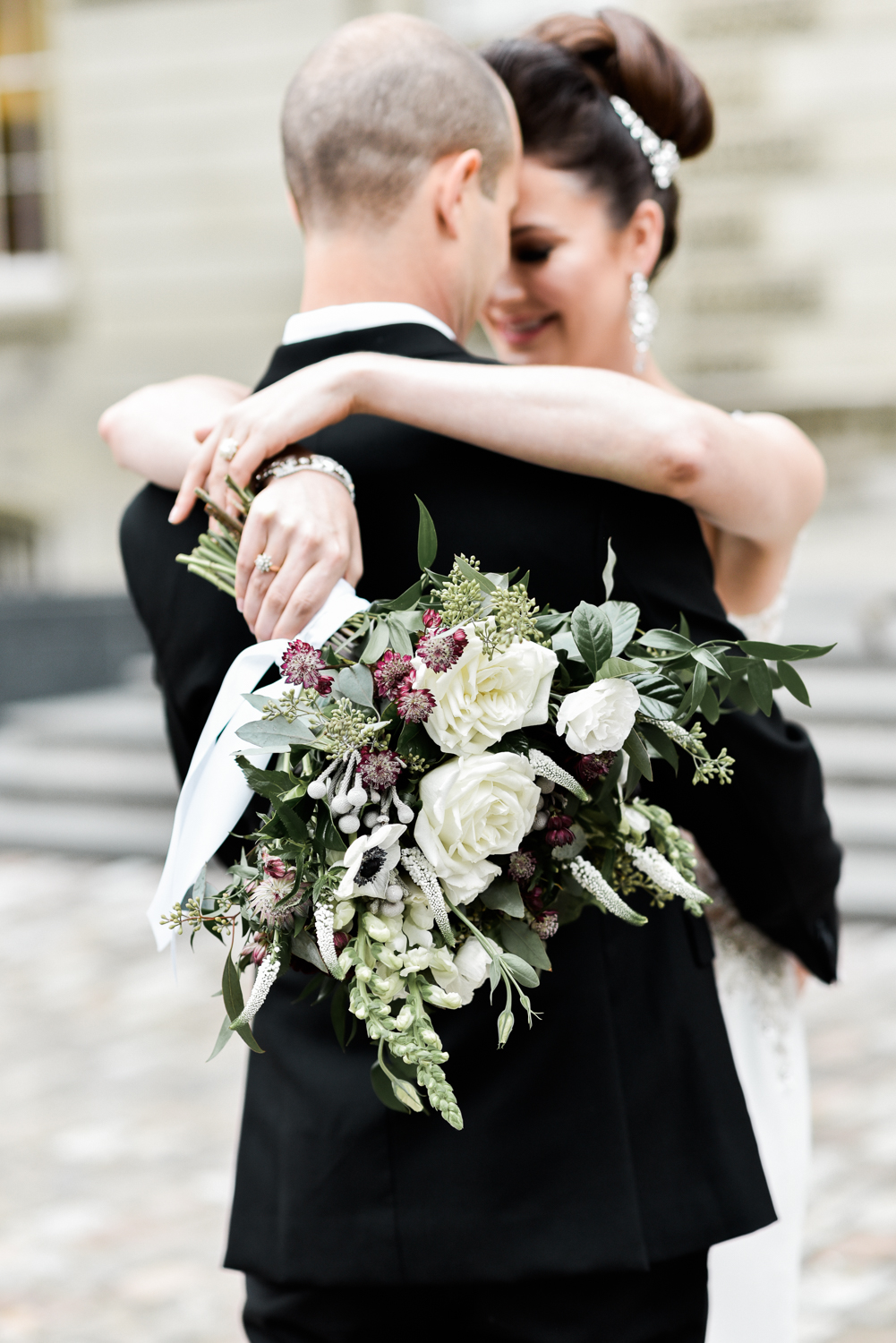 Gorgeous white, green, and dark purple bridal bouquet