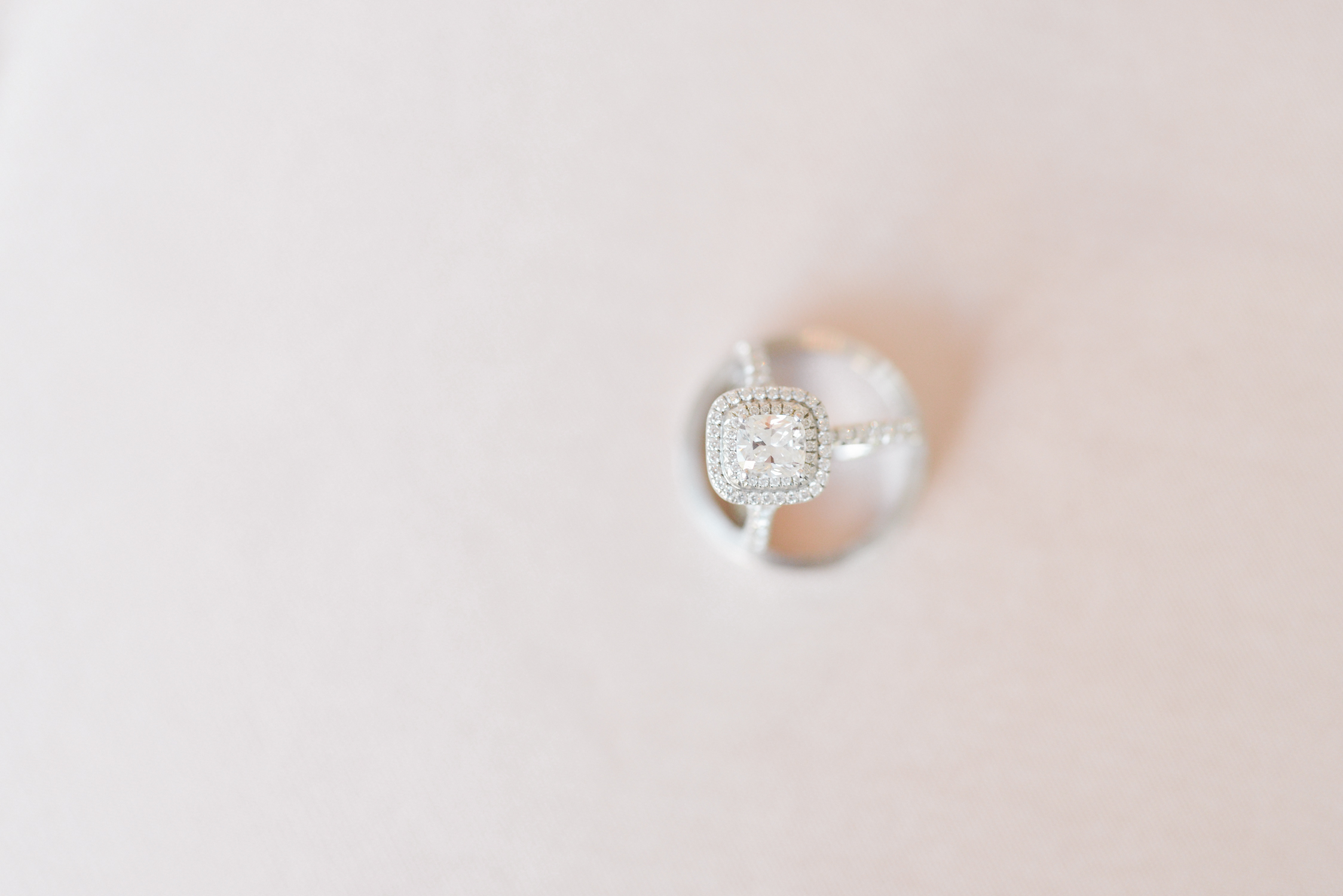Square diamond ring with pink background