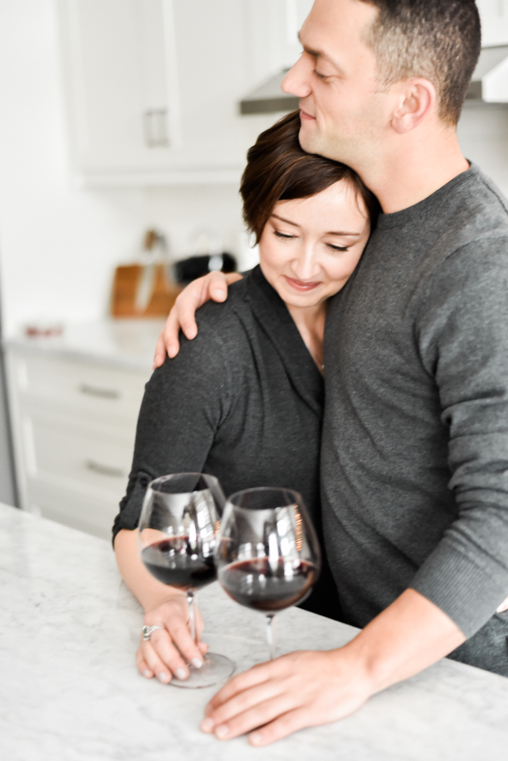 Glasses of red wine engagement session