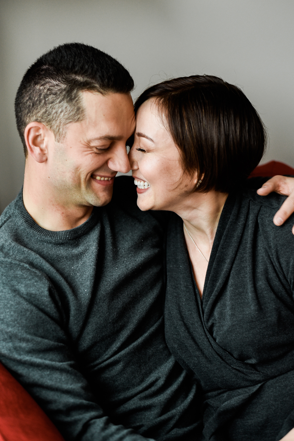 Laughing, intimate engagement photo