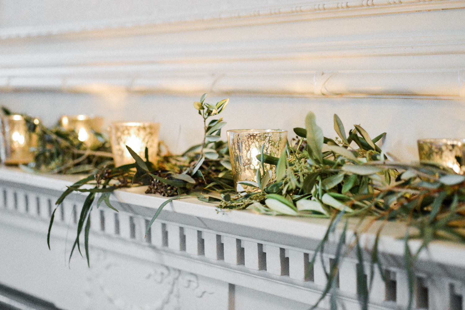 Green Garlands with lots of candles on a mantlepiece at Graydon Hall