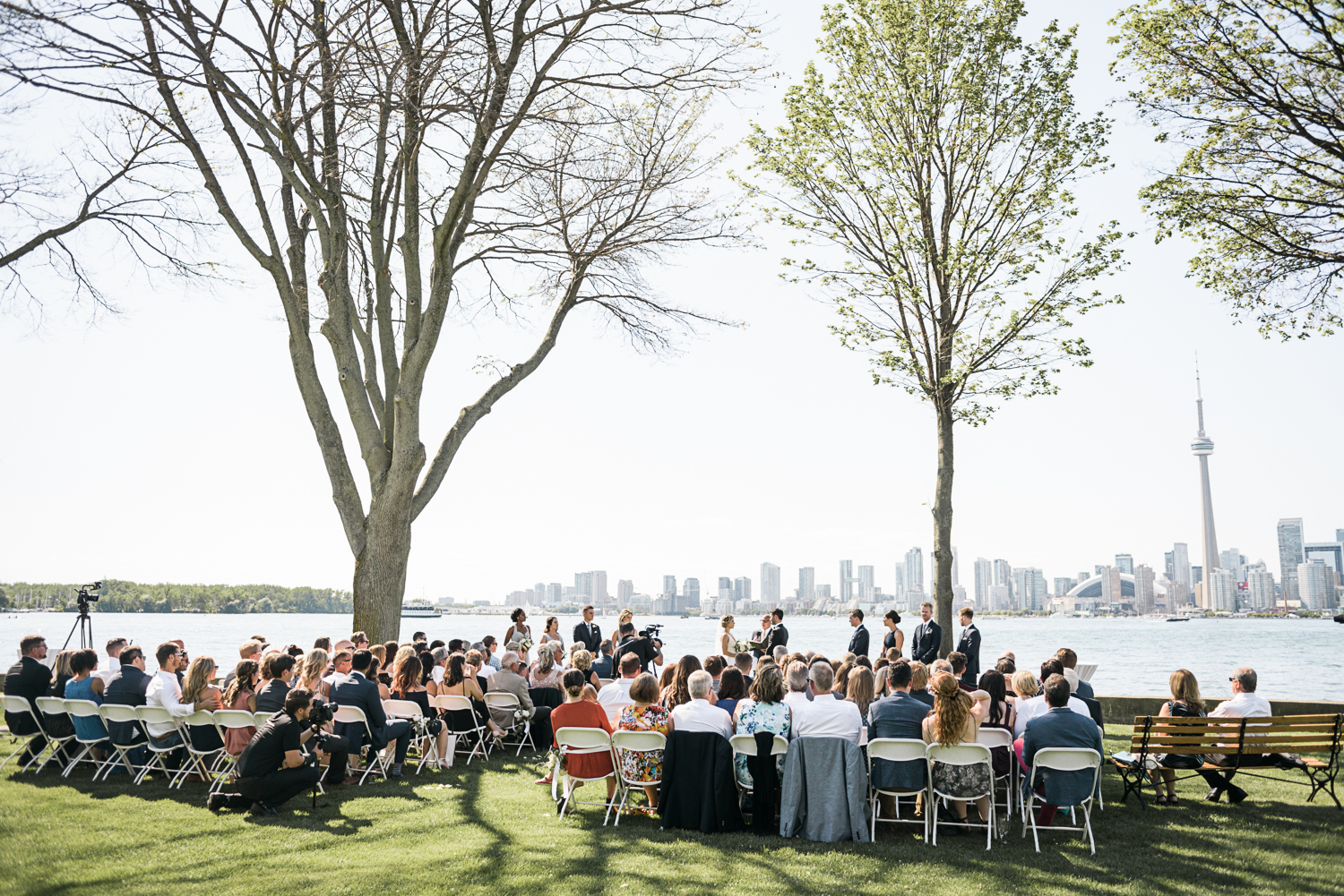 Ceremony taking place on the lawn of this RCYC wedding on Toronto island