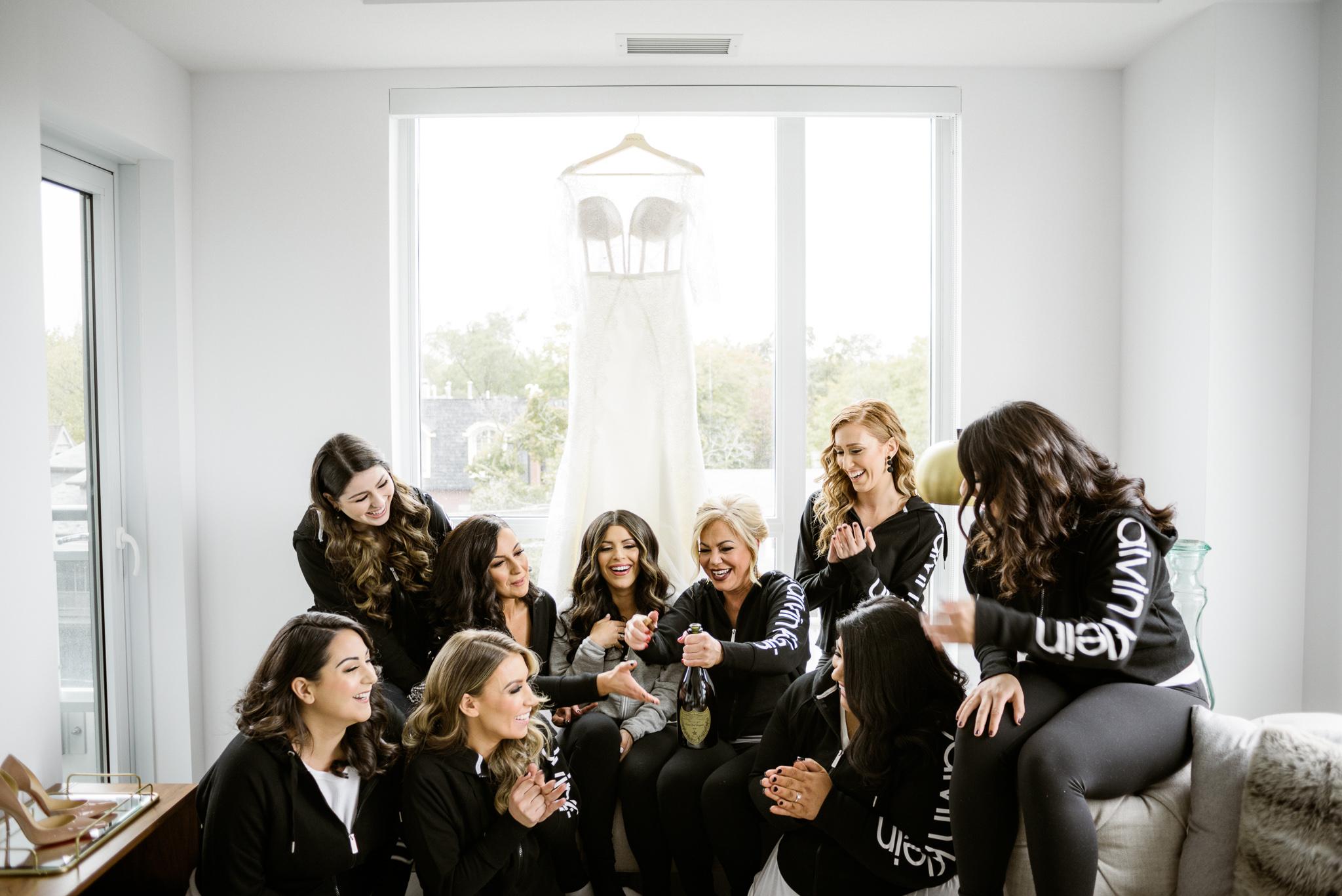 Bridemaids all wearing Calvin Klein sweaters to get ready
