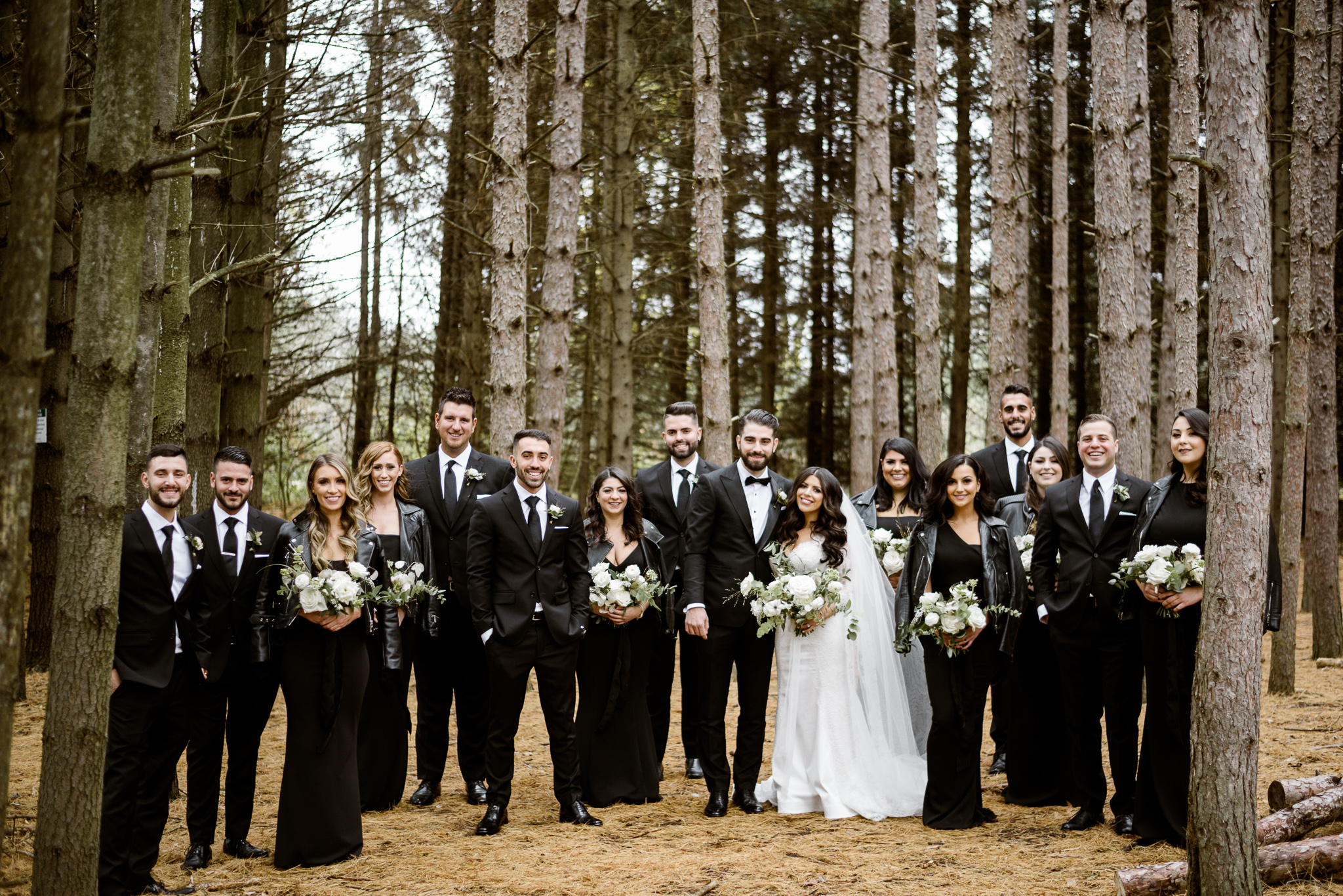 Entire bridal party in the woods of Kortright Centre