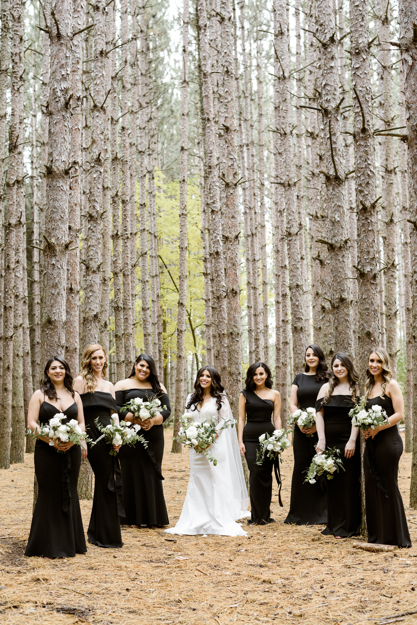 Stunning bridesmaids dressed in floor length all black