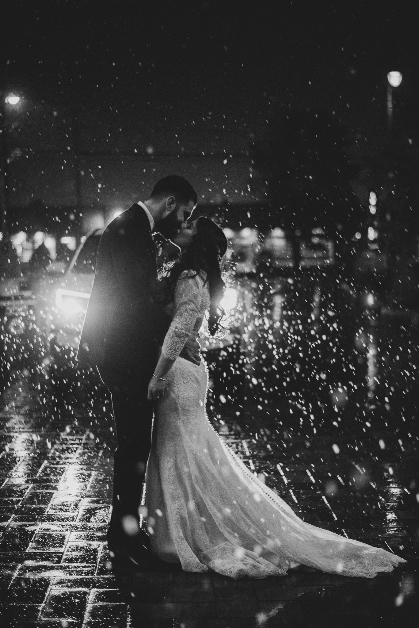 Night time wedding photo of a bride and groom in the snow