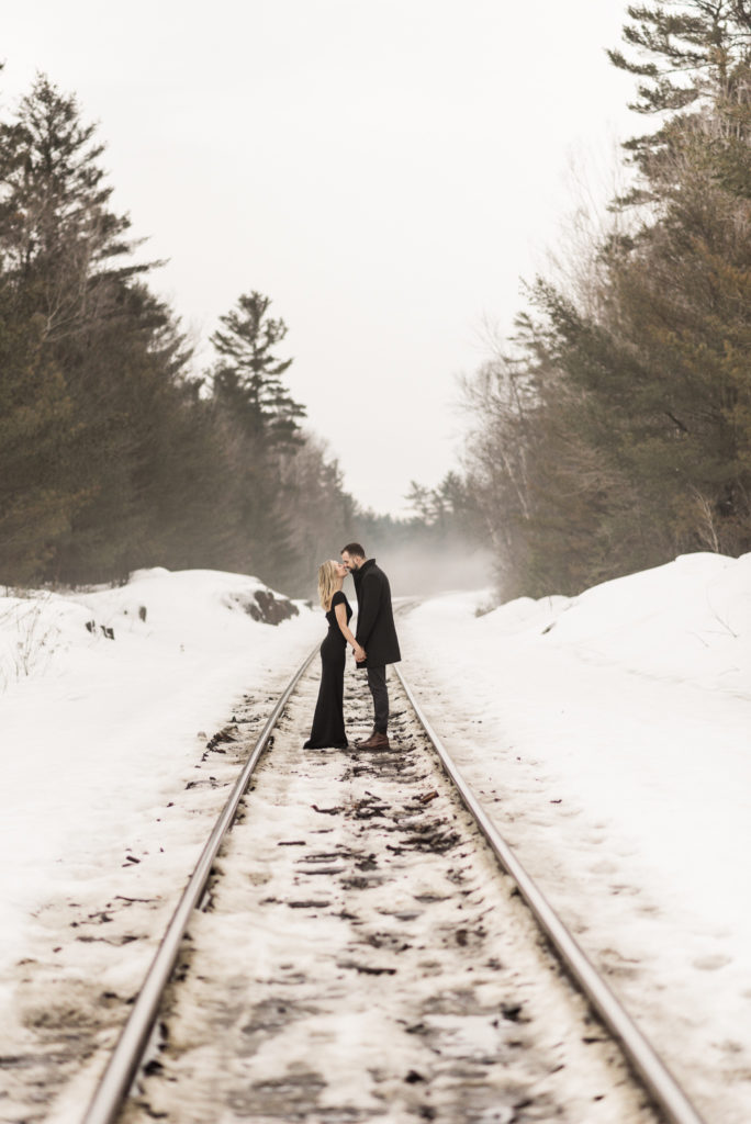 Train track engagement photos in the winter