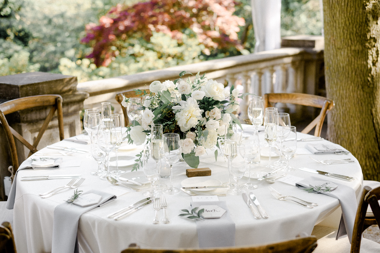 Beautiful green and white tablescape on the terrace of Graydon Hall